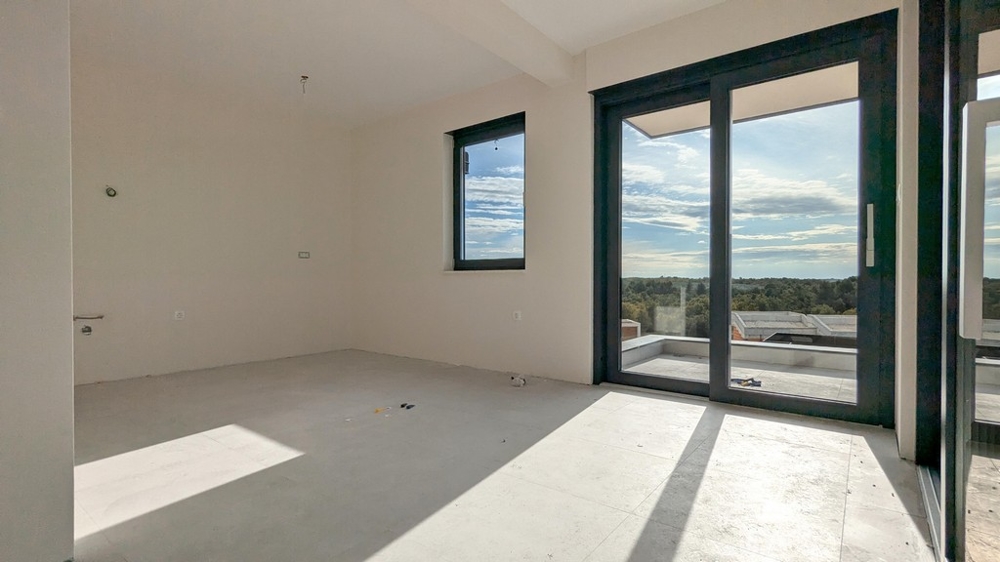 Obývacia izba s prístupom na terasu bytu A3536 na Istrii.