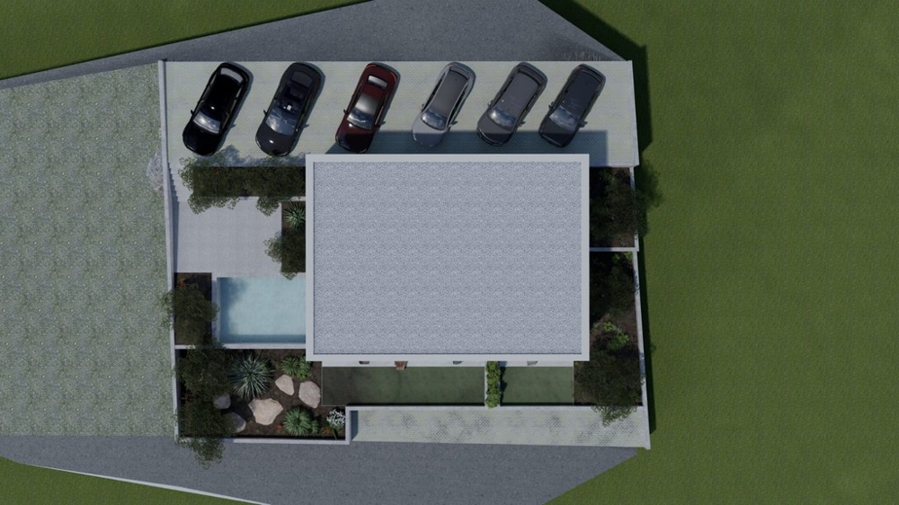 Pohľad zhora na obytné budovy s parkovacími miestami a bazénom