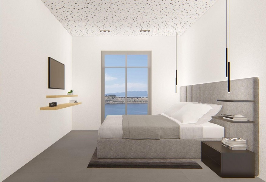 Spálňa s výhľadom na more a moderným dizajnom