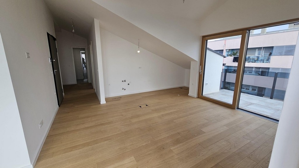 Obývacia časť s výstupom na balkón