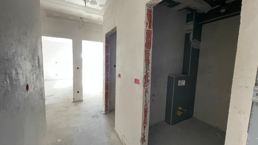 Predsieň s prístupom do kúpeľne a obývacej časti