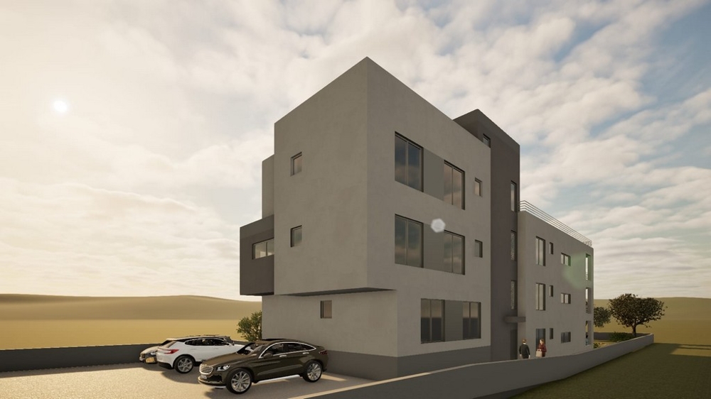 Novostavba obytného domu s parkovacími miestami pred budovou