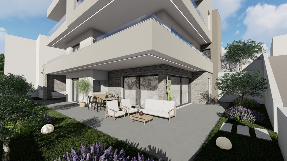 Krytá terasa s obývacím nábytkom a výhľadom na krajinu