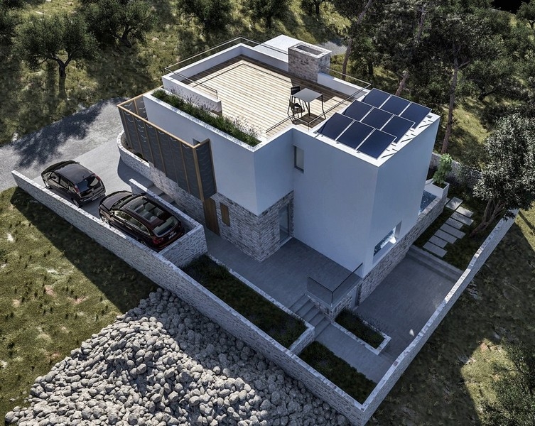 Pohľad z dronu na novo postavenú vilu so strešnou terasou a vonkajším priestorom na predaj v meste Krk, Chorvátsko, obklopenú olivovníkmi