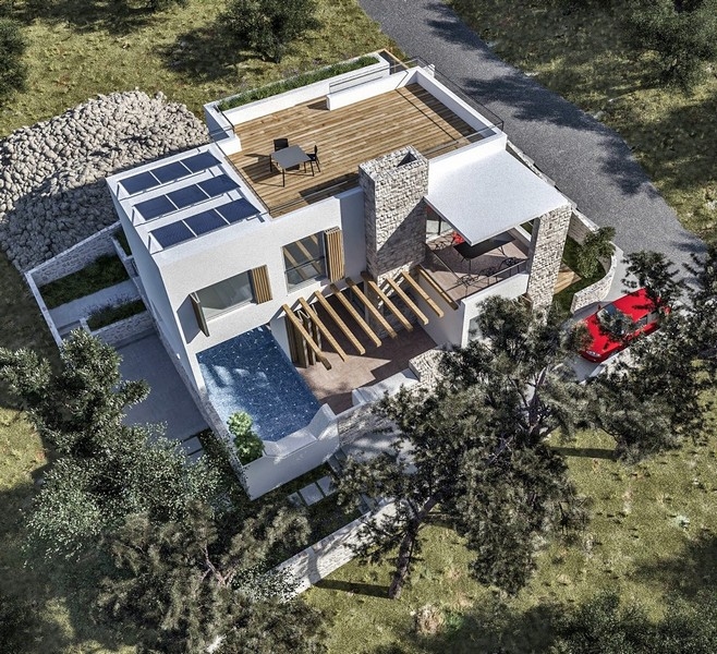 Fáza výstavby vily na predaj na chorvátskom ostrove Krk s oranžovými tehlovými múrmi a betónovými konštrukciami