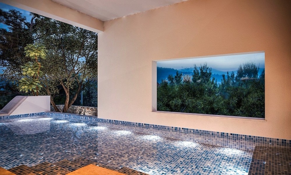 Večerný pohľad na osvetlený krytý bazén vily na predaj v obci Jezera na ostrove Murter v Chorvátsku