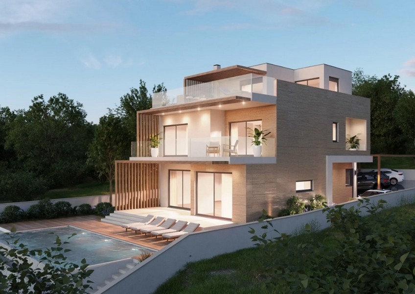 Letecký pohľad na modernú nehnuteľnosť v Chorvátsku, vila s výhľadom na more v noci