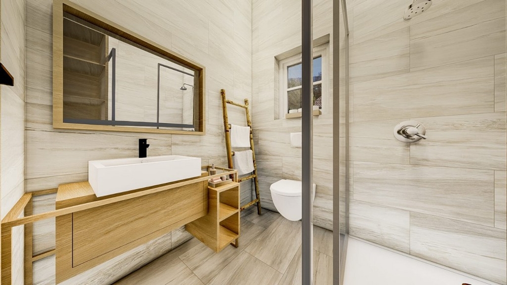Moderná kúpeľňa so svetlým dreveným nábytkom, veľkým zrkadlom, skleneným sprchovacím kútom a bielym sociálnym zariadením.