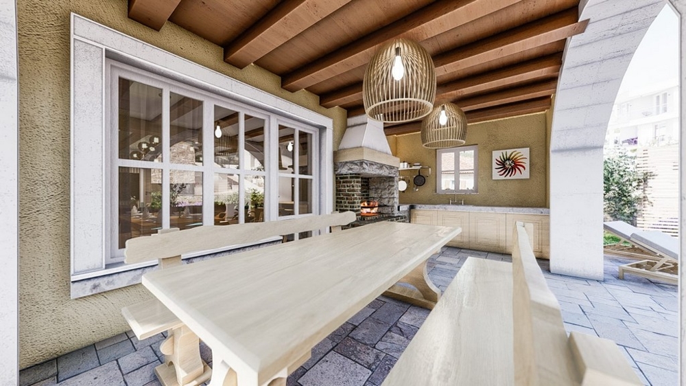Krytá vonkajšia terasa s jedálenským stolom v stredomorskej vile na ostrove Krk