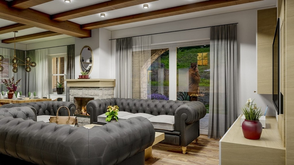 Obývacia izba stredomorskej vily s elegantnými šedými pohovkami a výhľadom do záhrady na ostrove Krk