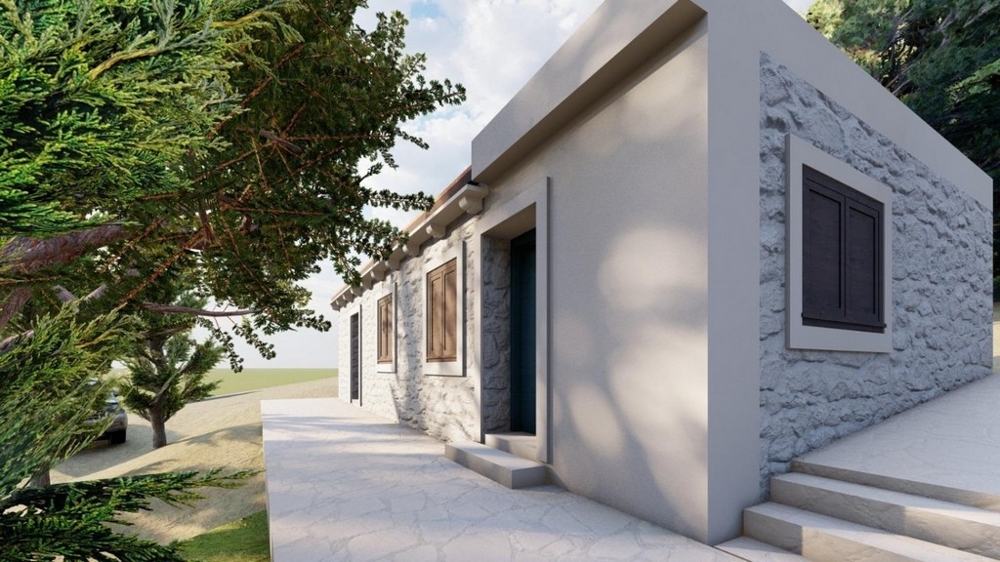 Dom s fasádou z prírodného kameňa a priestranným vonkajším priestorom