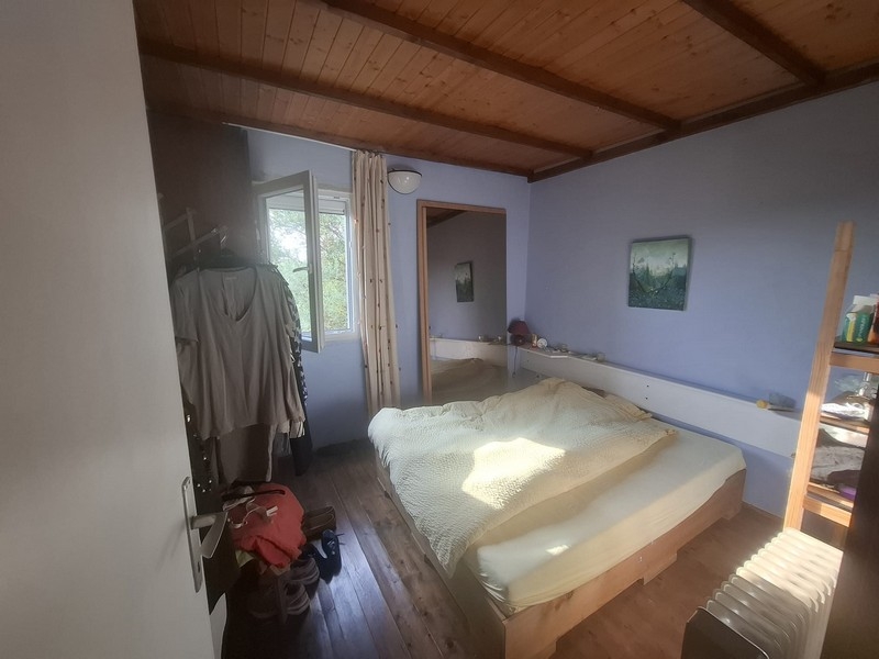 Spálňa s dreveným stropom v dome na ostrove Šolta